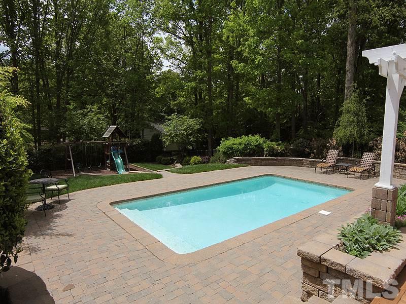 2305 Tyson Street Raleigh, NC 27612 - Photo 21 of 25 a view of a swimming pool with a yard