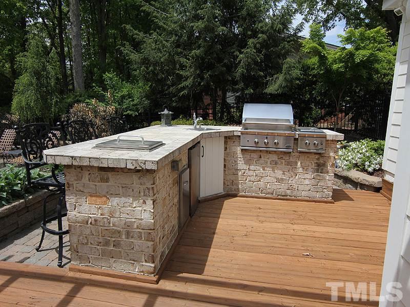 2305 Tyson Street Raleigh, NC 27612 - Photo 23 of 25 a view of a patio with table and chairs with wooden floor and fence
