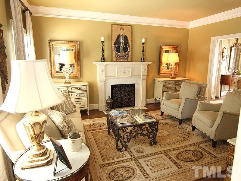 2305 Tyson Street Raleigh, NC 27612 - Photo 4 of 25 a living room with furniture and a fireplace