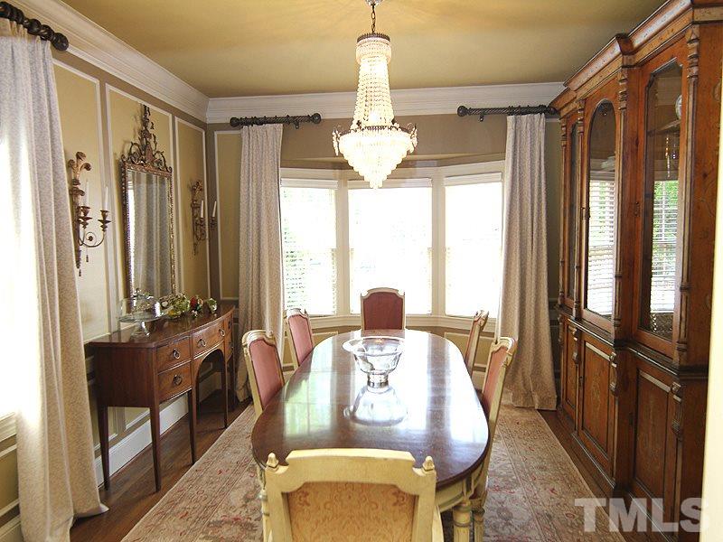 2305 Tyson Street Raleigh, NC 27612 - Photo 7 of 25 a view of a dining room with furniture window and outside view