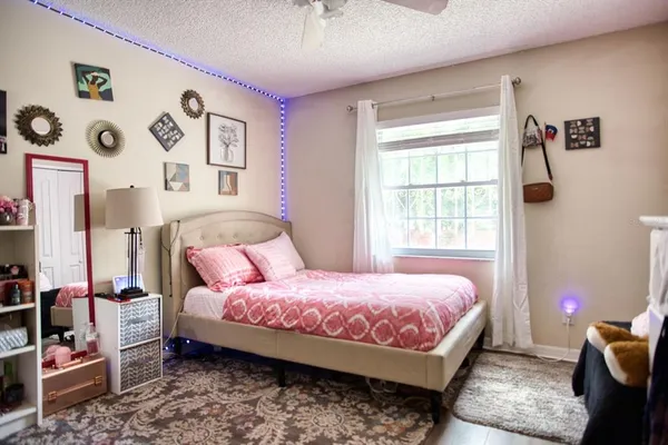 a bedroom with furniture and a window