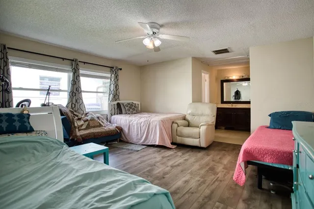 a bathroom with a sink double vanity granite and toilet