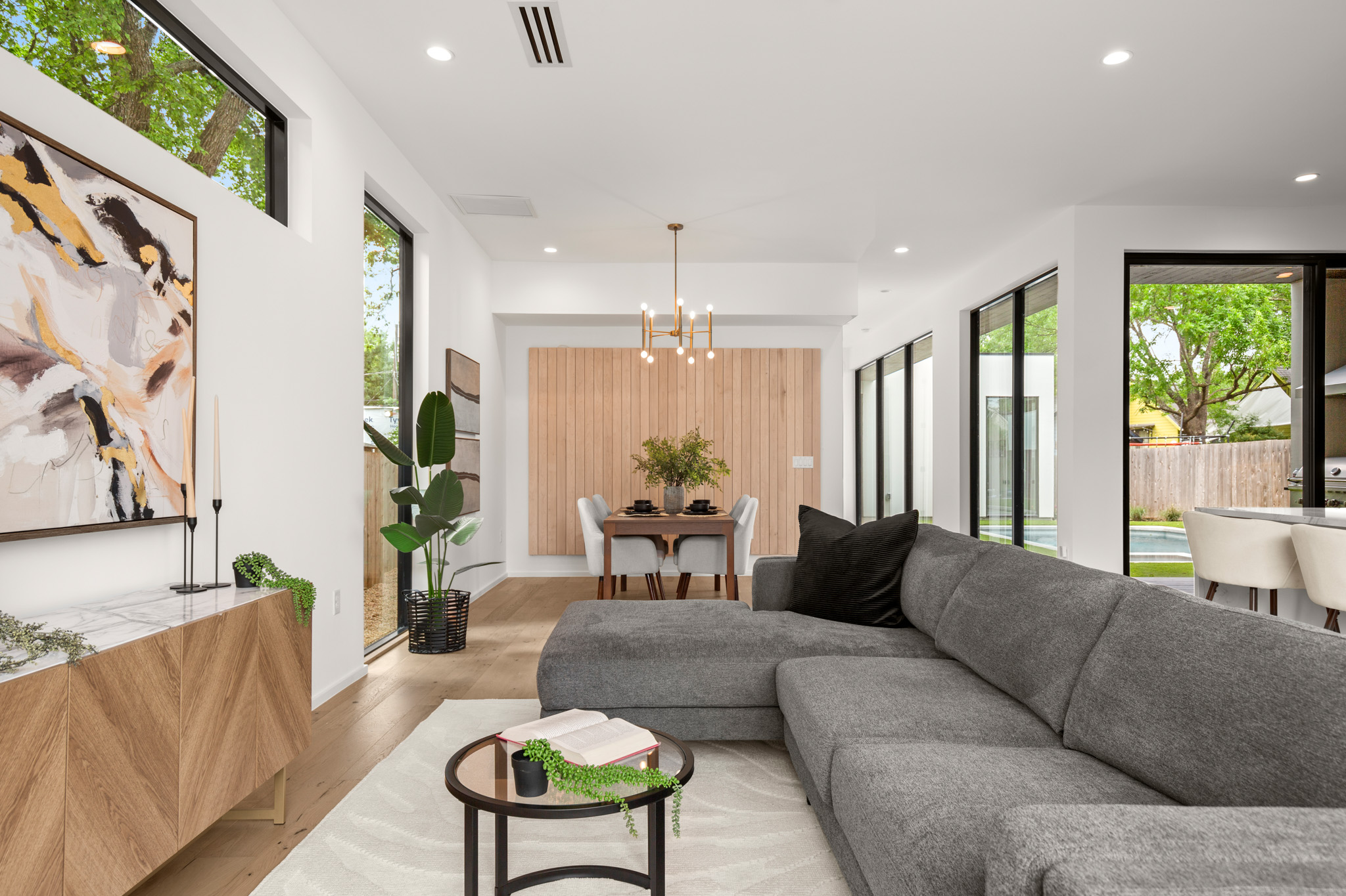 1805 Collier Street Austin, TX 78704 - Photo 11 of 39 Living area with light wood-type flooring and a chandelier