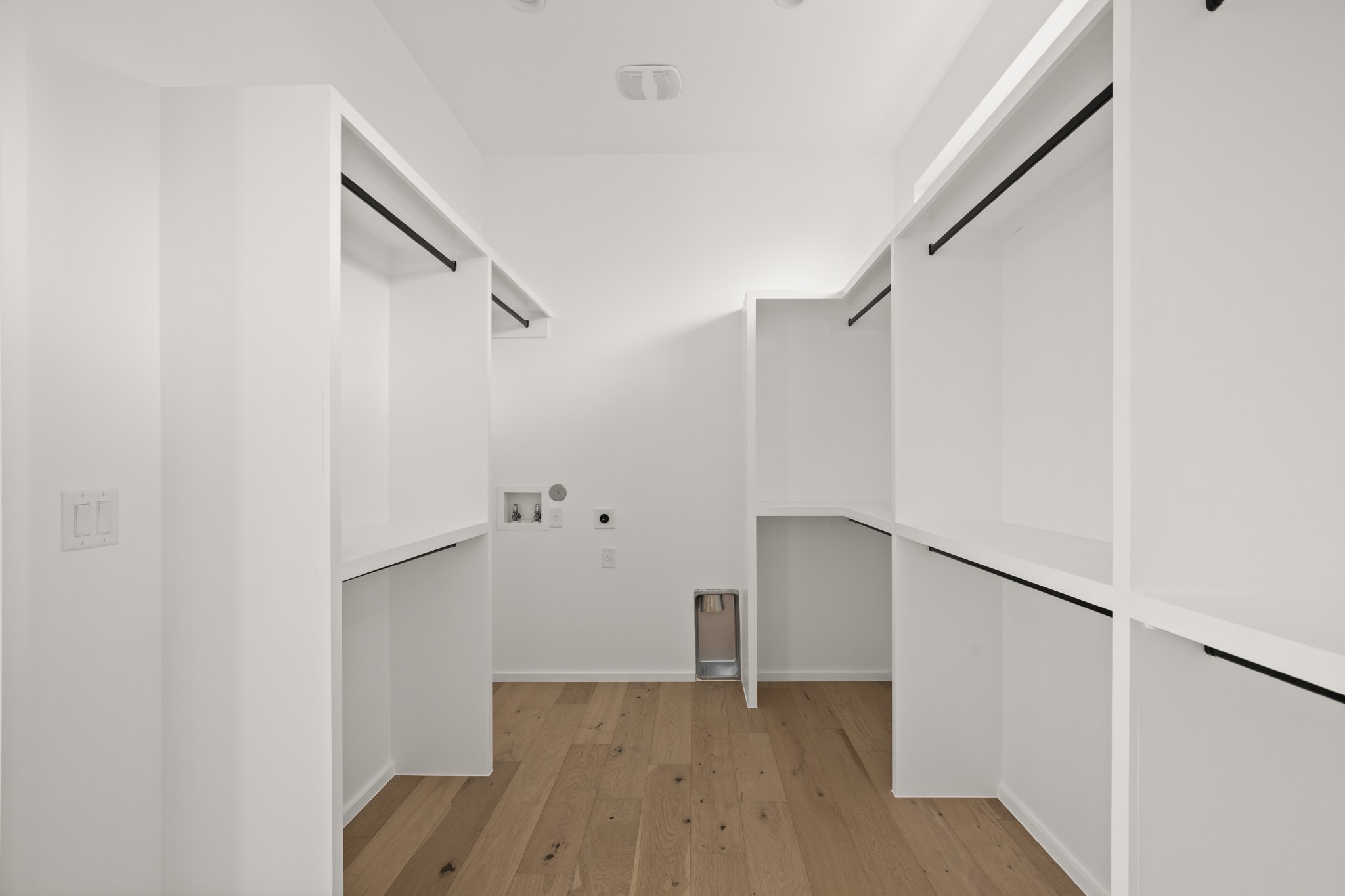 1805 Collier Street Austin, TX 78704 - Photo 21 of 39 Laundry area featuring light wood-style floors, washer hookup, and hookup for an electric dryer