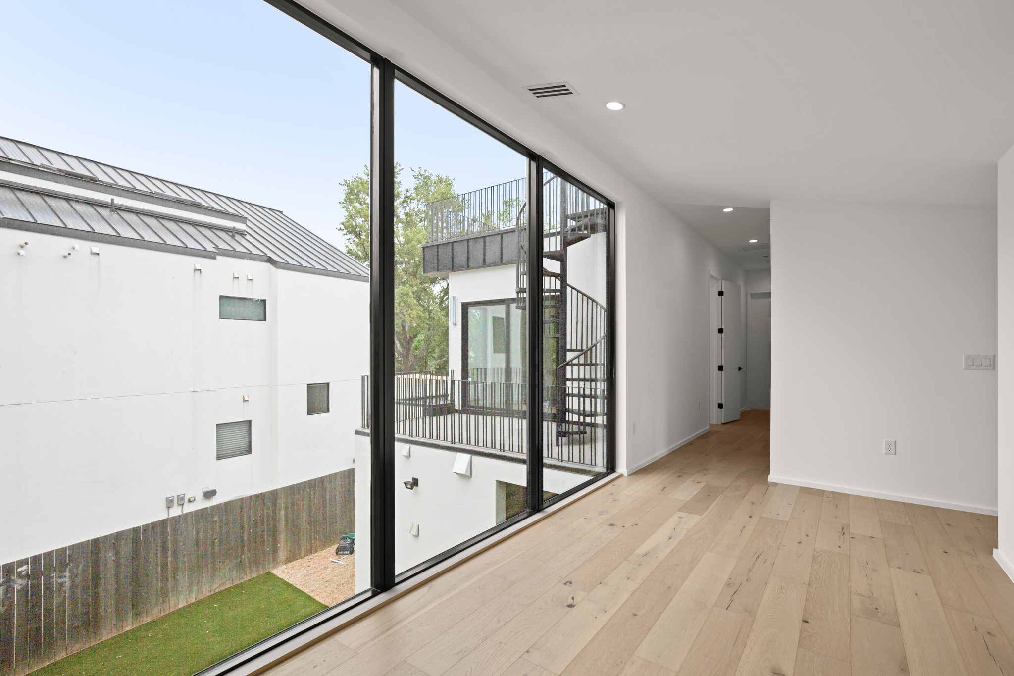 1805 Collier Street Austin, TX 78704 - Photo 26 of 39 Entryway with hardwood / wood-style floors and recessed lighting
