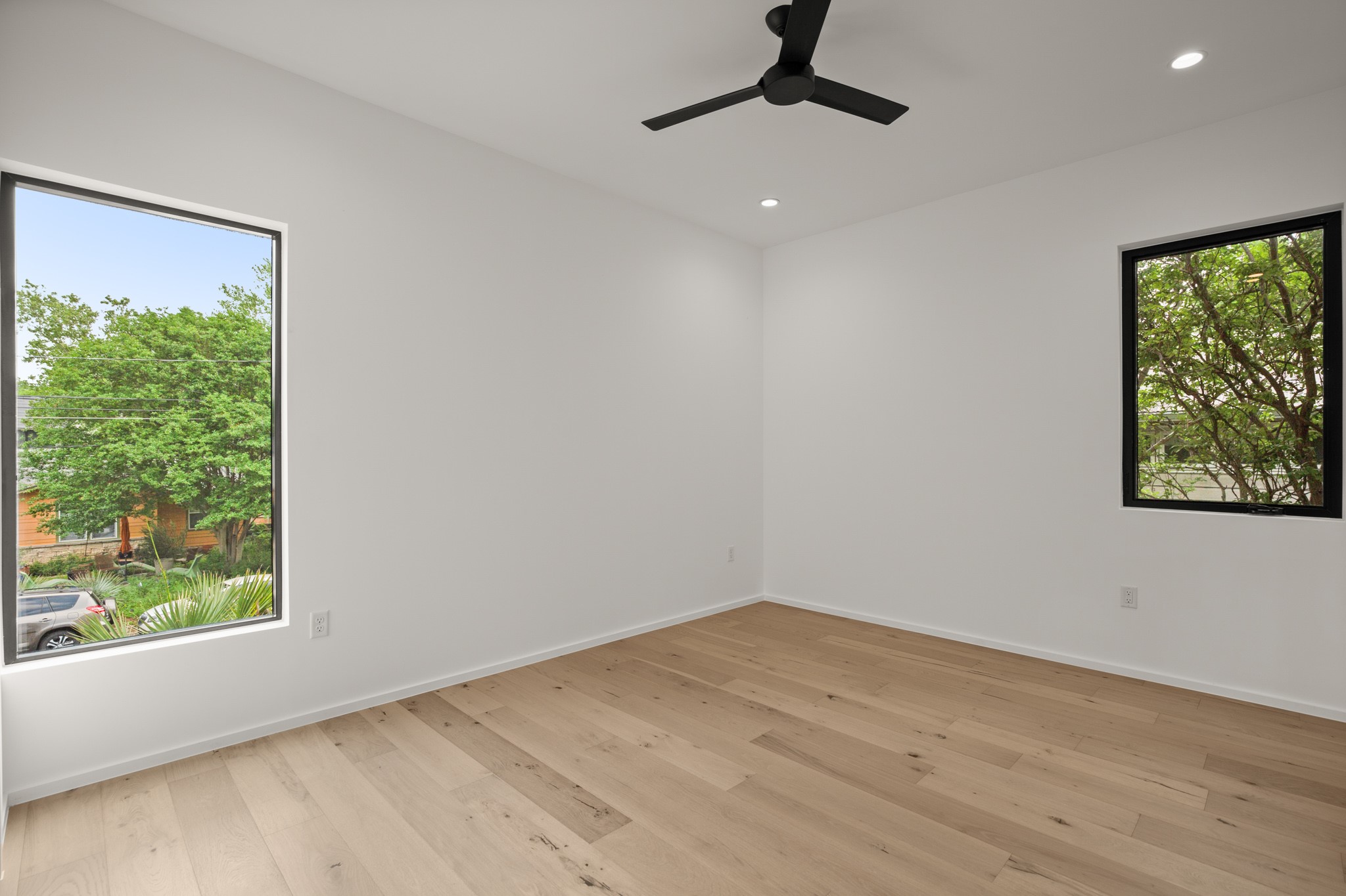 1805 Collier Street Austin, TX 78704 - Photo 28 of 39 Unfurnished room featuring light wood finished floors, recessed lighting, and ceiling fan