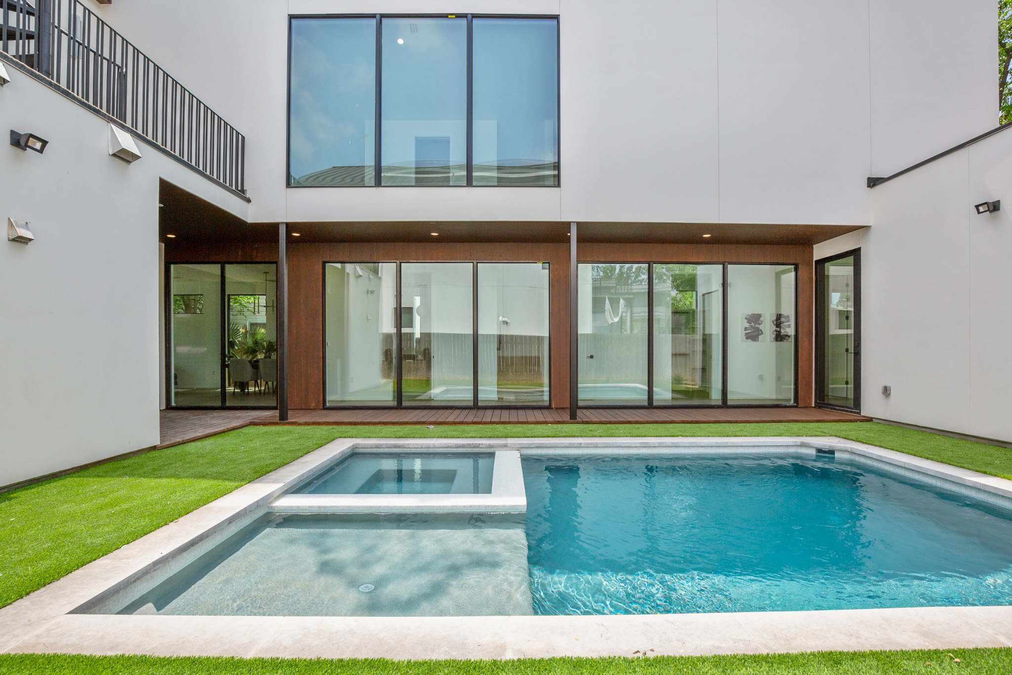 1805 Collier Street Austin, TX 78704 - Photo 37 of 39 Rear view of house with a pool with connected hot tub and a patio area