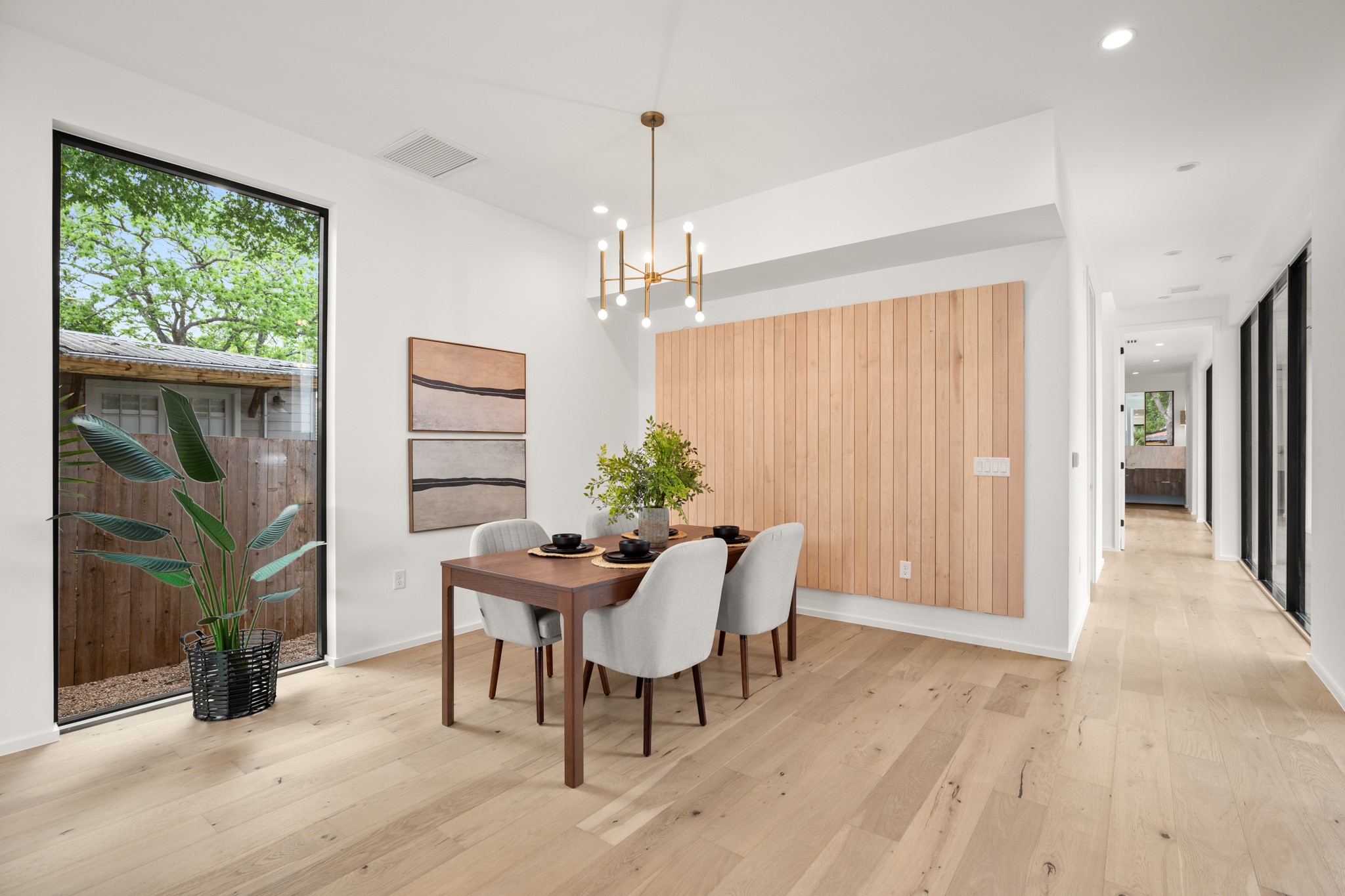 1805 Collier Street Austin, TX 78704 - Photo 8 of 39 Dining room with light wood finished floors and a chandelier