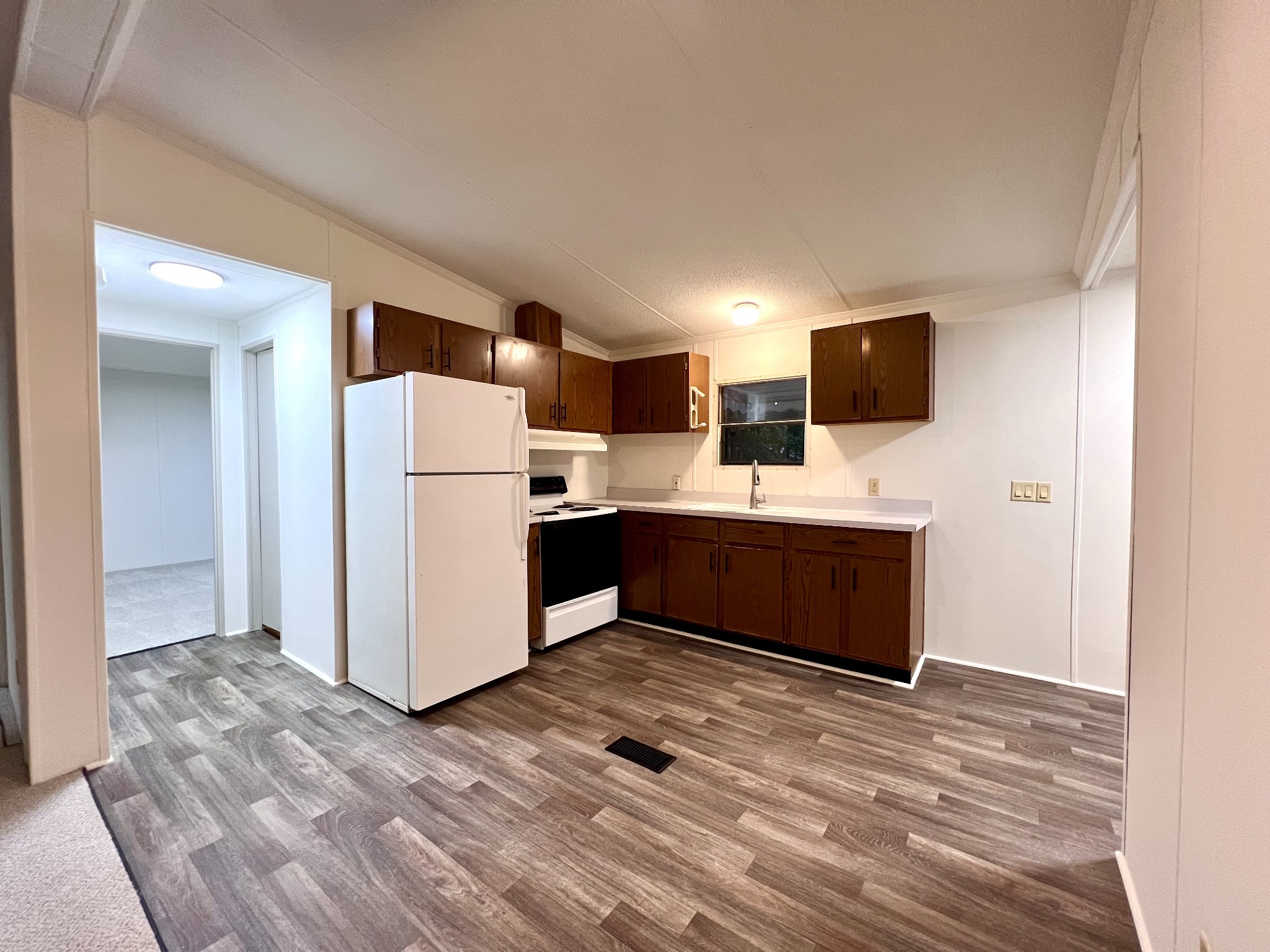 413 Elm Lane Beechgrove, TN 37018 - Photo 4 of 15 a kitchen with a refrigerator and a microwave