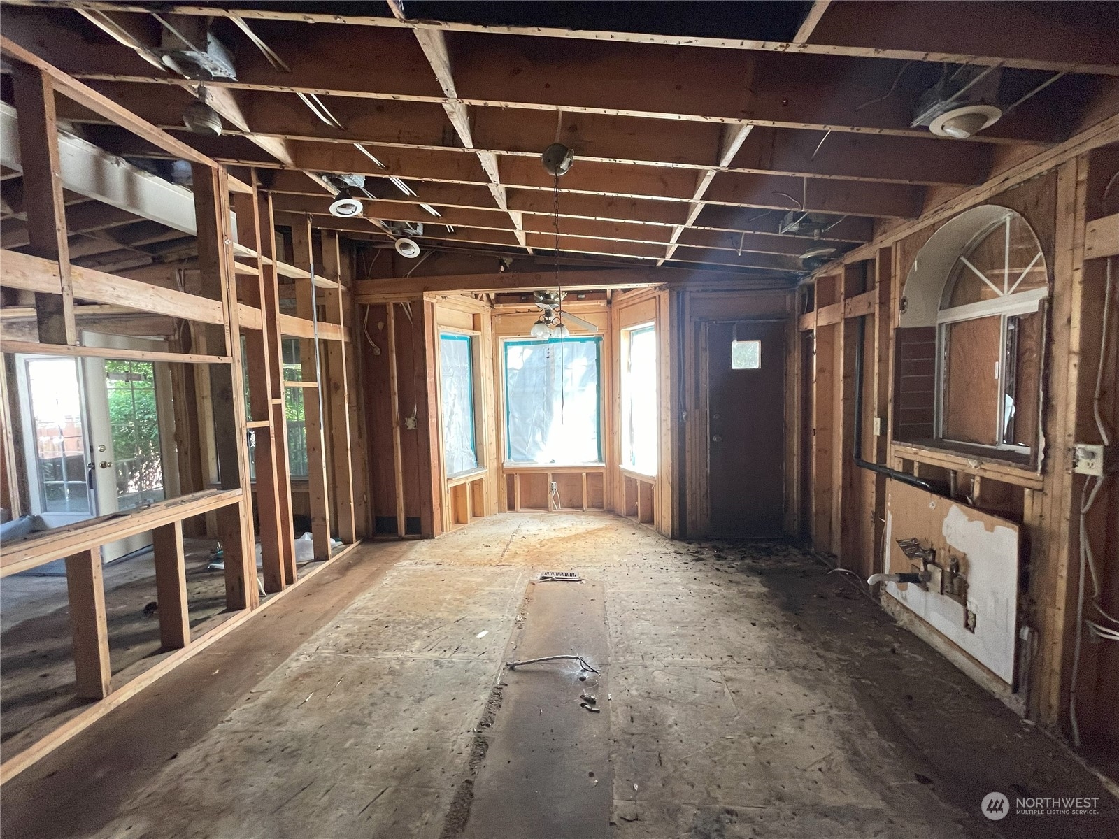 4902 241st Street Southwest Mountlake Terrace, WA 98043 - Photo 24 of 28 a view of an empty room with wooden floor and windows