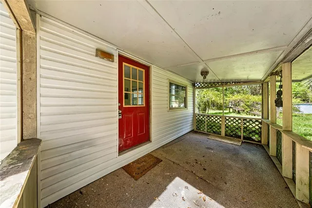a view of a porch with wooden floor