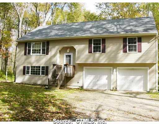 248 Beaver Hill Road Windham, CT 06256 - Photo 1 of 1 a front view of a house with a garden