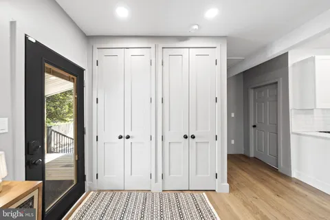 a lobby with furniture and wooden floor