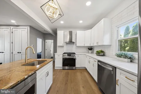 a kitchen with a stove and a refrigerator
