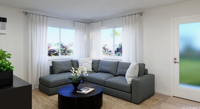 a living room with furniture a flat screen tv and a potted plant