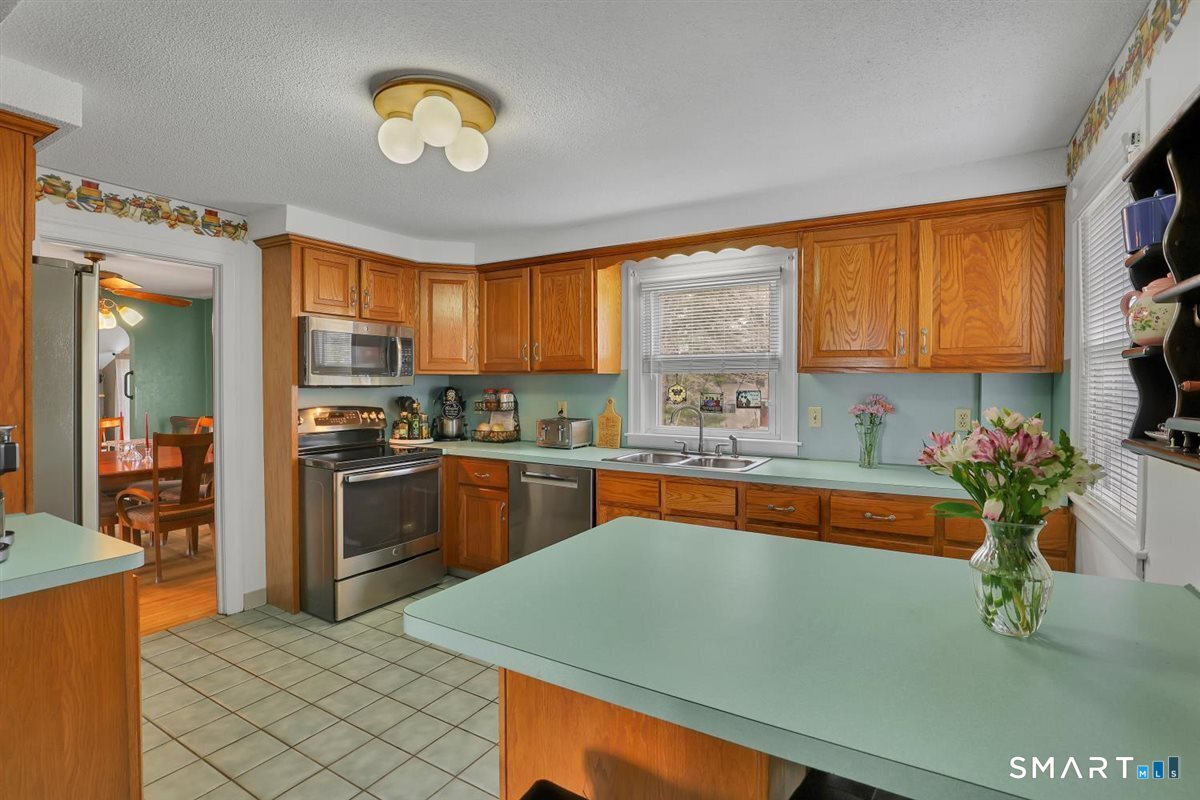 236 Cross Street Middletown, CT 06457 - Photo 12 of 39 Your kitchen is nicely appointed in most desirable stainless steel appliances.