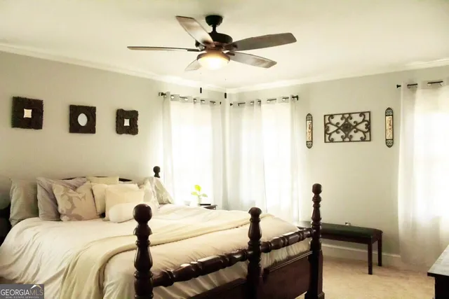 a bed room with a bed and a chair