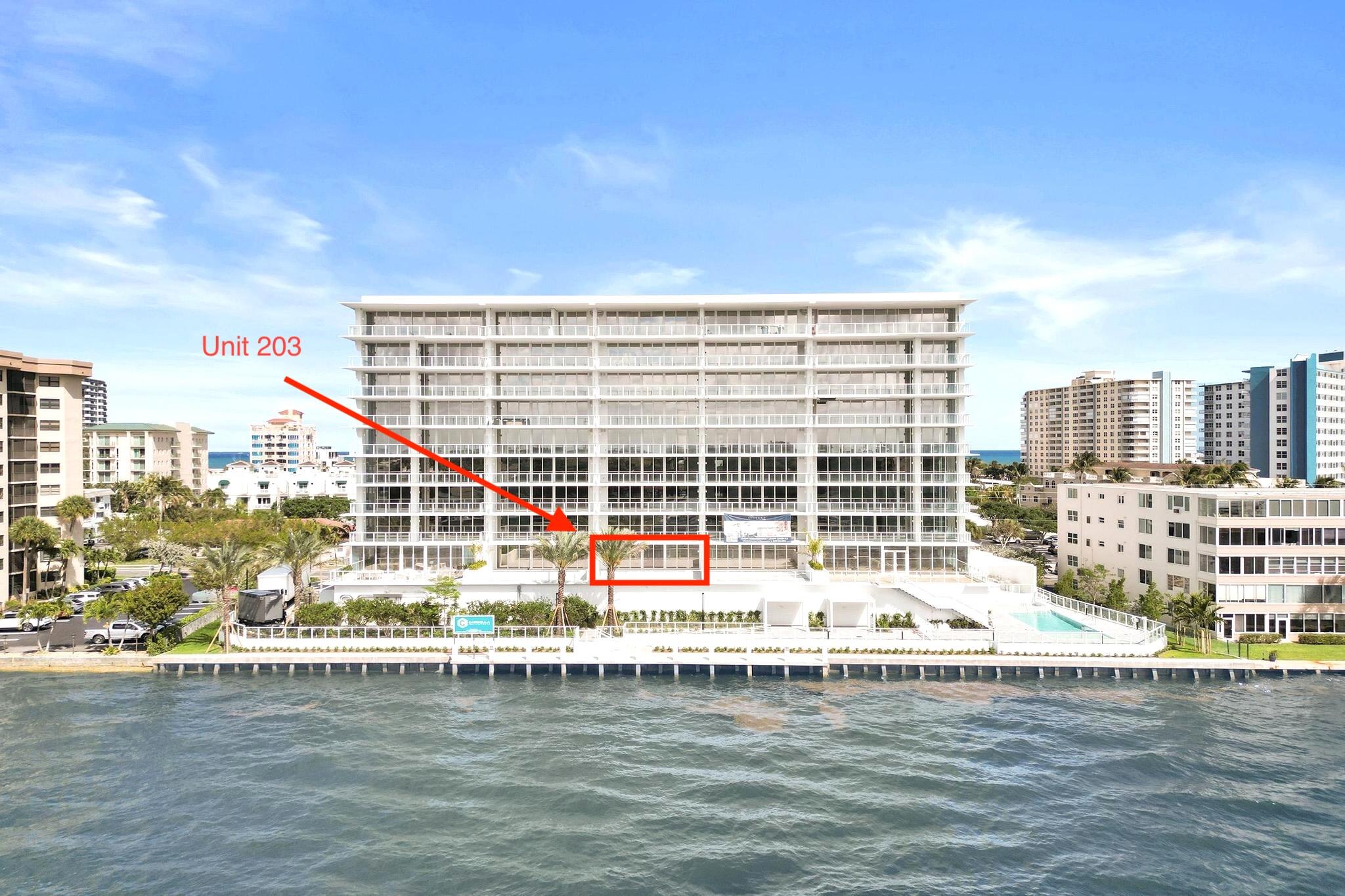 407 North Riverside Drive, Unit 203 Pompano Beach, FL 33062 - Photo 2 of 69 a view of a swimming pool with outdoor seating