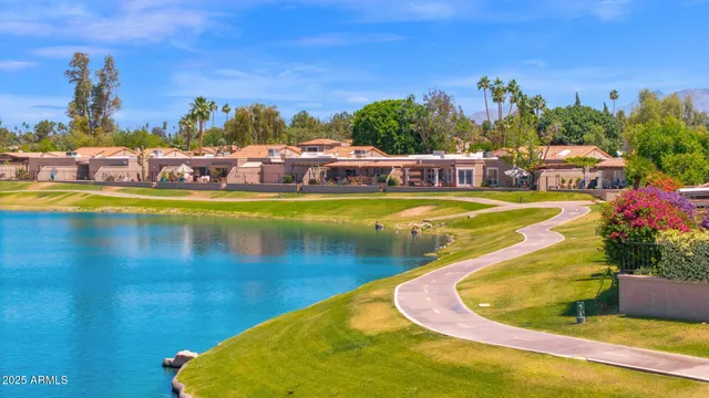 a view of a swimming pool with an outdoor seating
