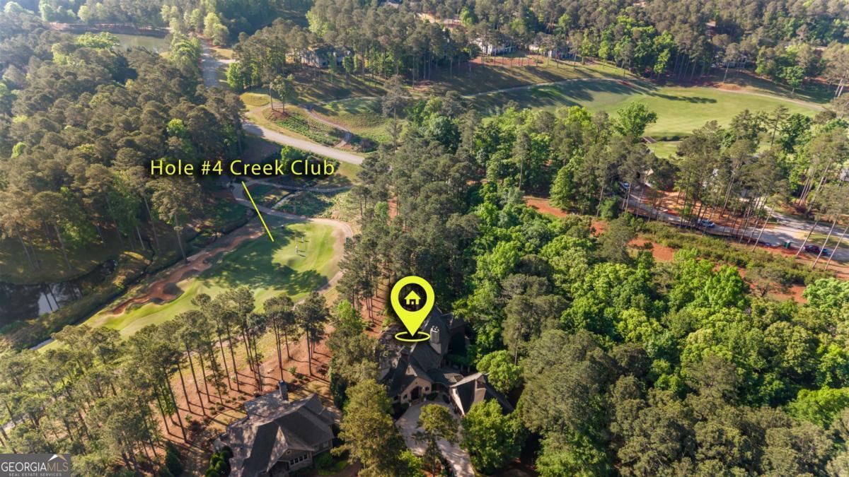 1090 Spring Creek Greensboro, GA 30642 - Photo 12 of 75 a view of a street with sign board