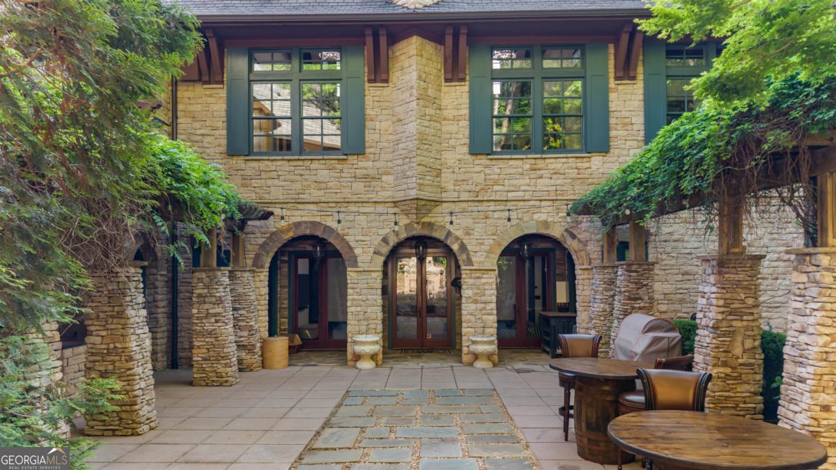 1090 Spring Creek Greensboro, GA 30642 - Photo 16 of 75 a front view of a house with outdoor seating