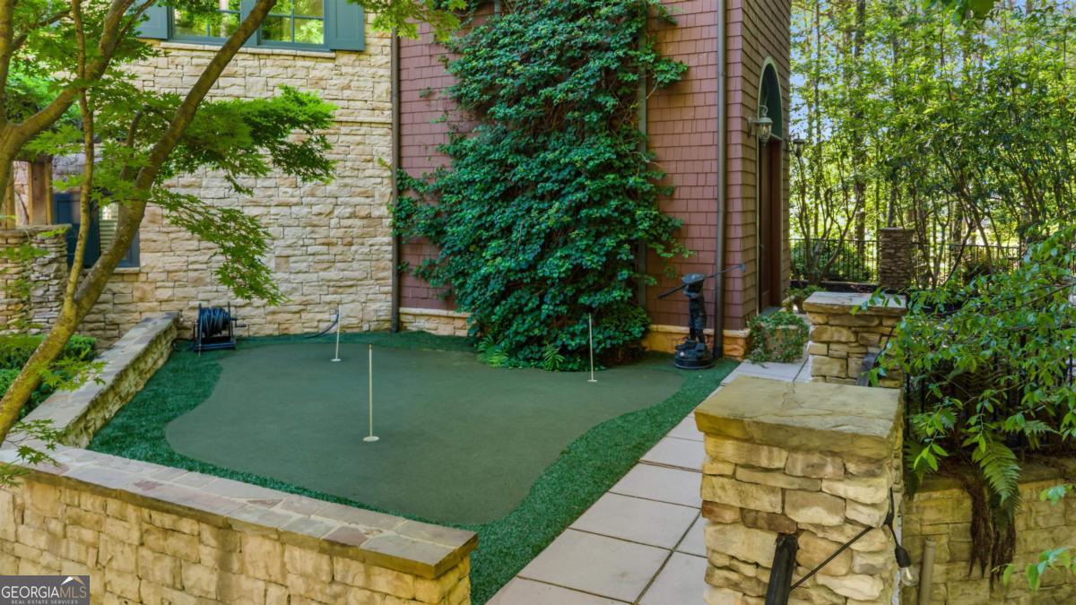 1090 Spring Creek Greensboro, GA 30642 - Photo 17 of 75 a view of a garden with a fountain