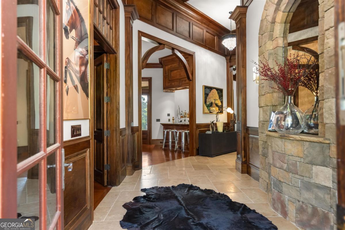1090 Spring Creek Greensboro, GA 30642 - Photo 19 of 75 a view of living room kitchen and entryway