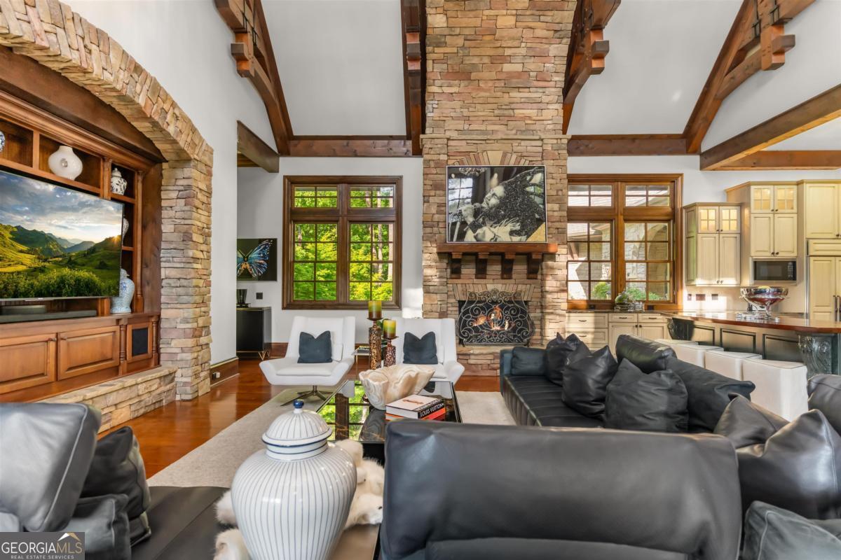 1090 Spring Creek Greensboro, GA 30642 - Photo 25 of 75 a living room with furniture and a large window