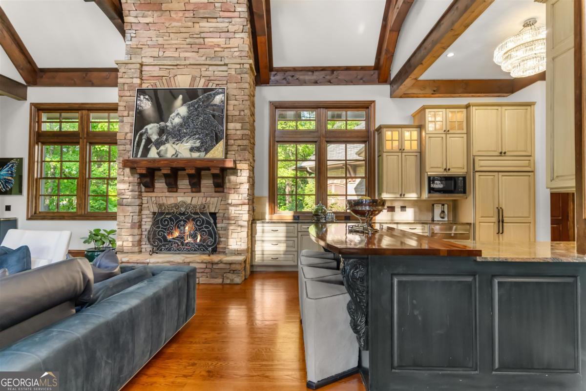 1090 Spring Creek Greensboro, GA 30642 - Photo 27 of 75 a living room with fireplace furniture and a large window