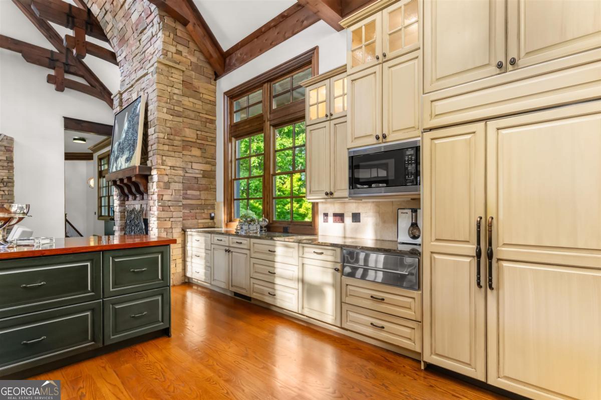 1090 Spring Creek Greensboro, GA 30642 - Photo 31 of 75 a kitchen with stainless steel appliances a refrigerator and a stove