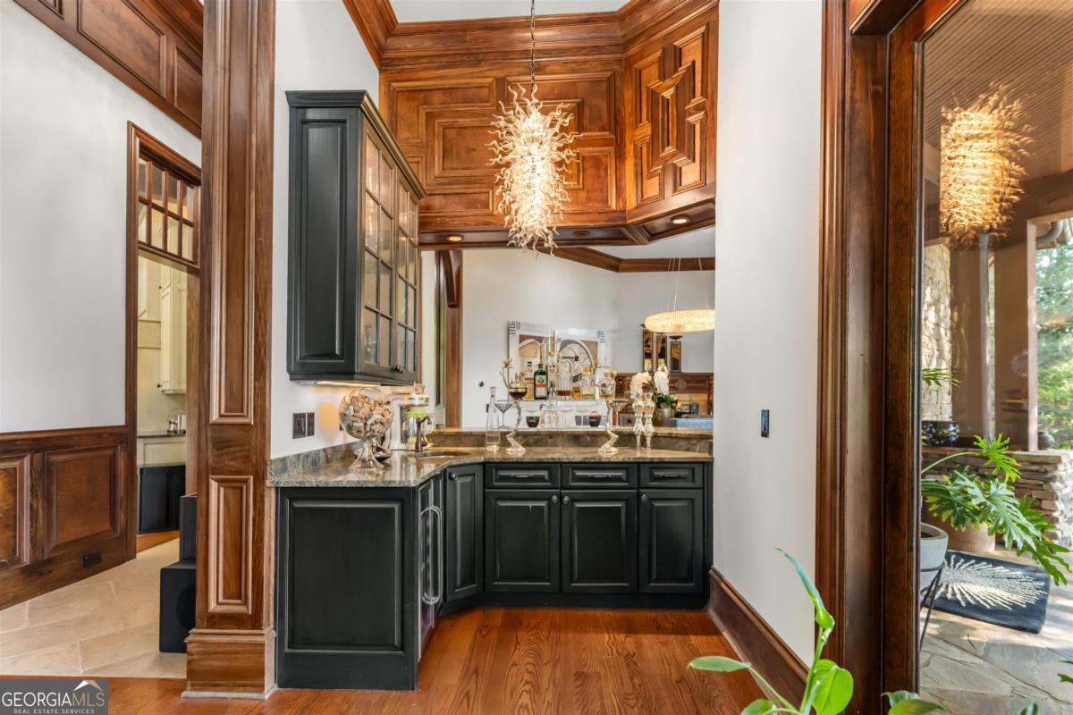 1090 Spring Creek Greensboro, GA 30642 - Photo 33 of 75 a kitchen with stainless steel appliances granite countertop a stove and a sink