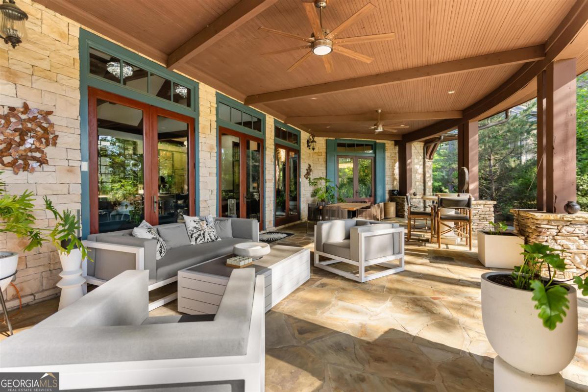1090 Spring Creek Greensboro, GA 30642 - Photo 37 of 75 a living room with furniture and a large window