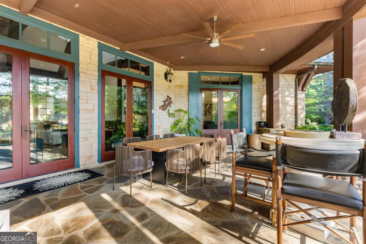 1090 Spring Creek Greensboro, GA 30642 - Photo 38 of 75 a living room with furniture a table and a large window