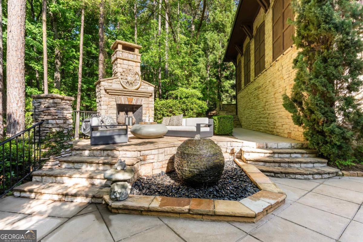 1090 Spring Creek Greensboro, GA 30642 - Photo 40 of 75 a view of a two chairs and a table in the patio