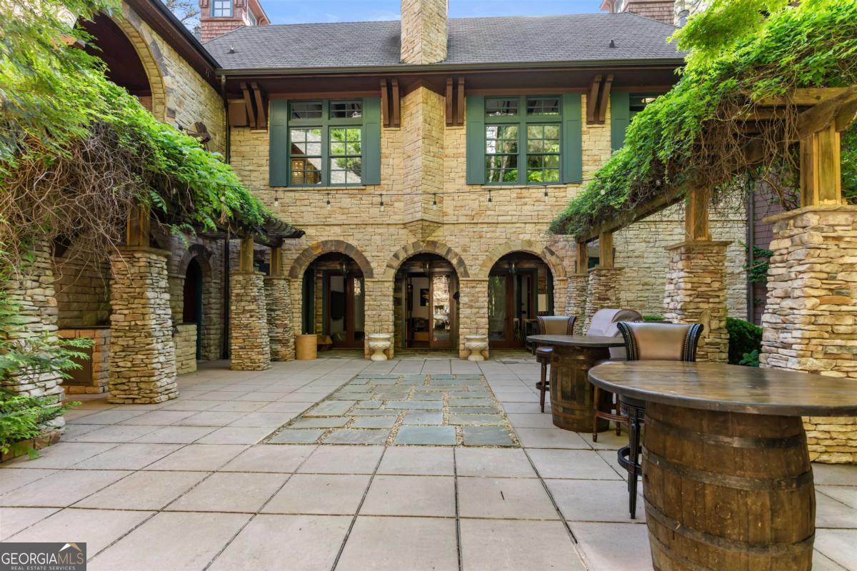 1090 Spring Creek Greensboro, GA 30642 - Photo 41 of 75 a view of a patio with table and chairs and potted plants