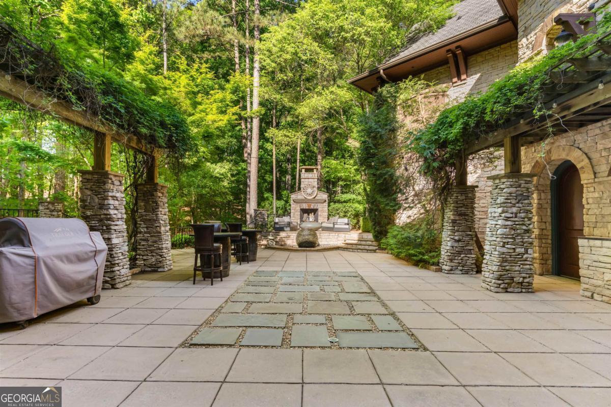 1090 Spring Creek Greensboro, GA 30642 - Photo 42 of 75 a view of a chairs and tables in the back yard of the house