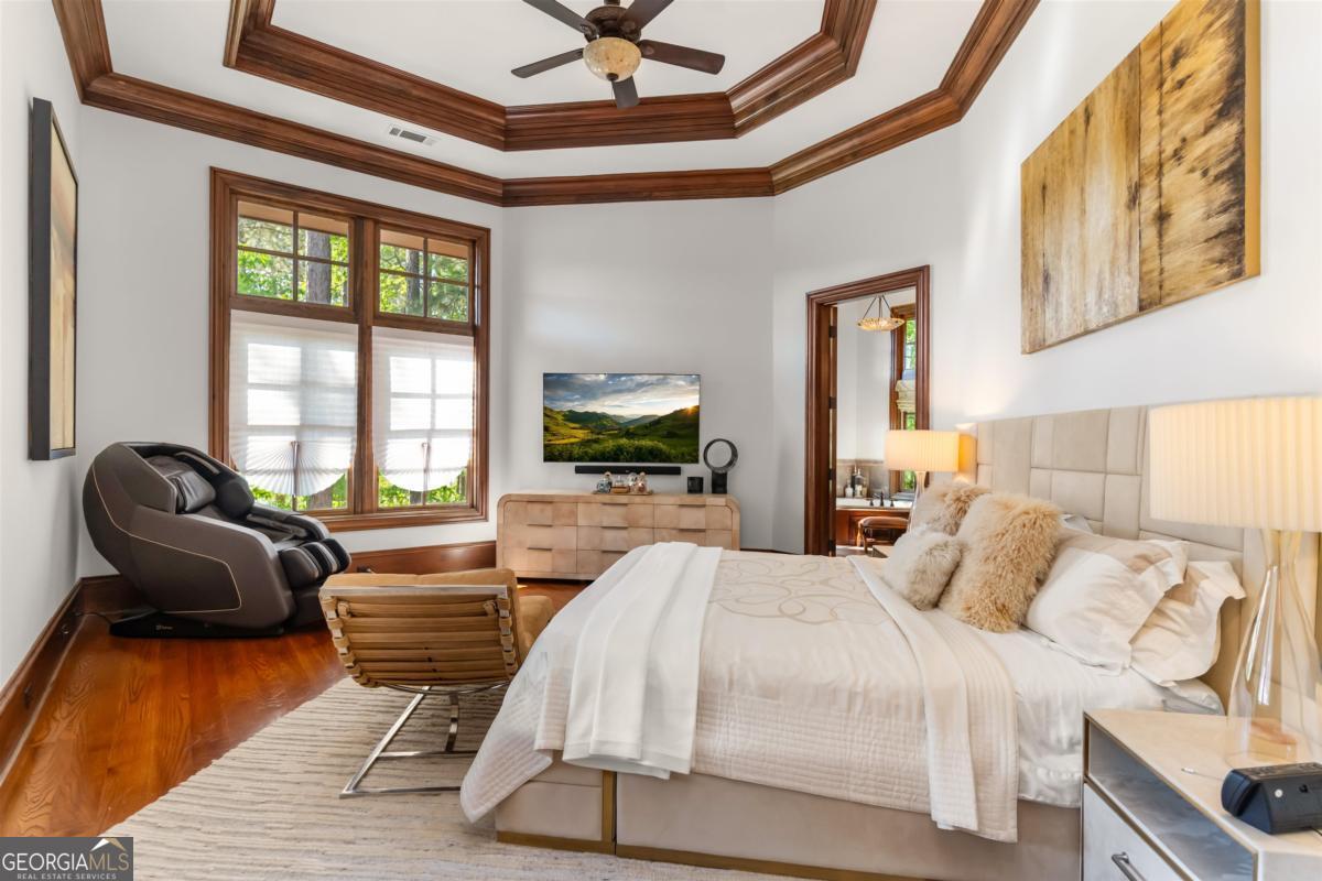 1090 Spring Creek Greensboro, GA 30642 - Photo 46 of 75 a bedroom with a bed and wooden floor