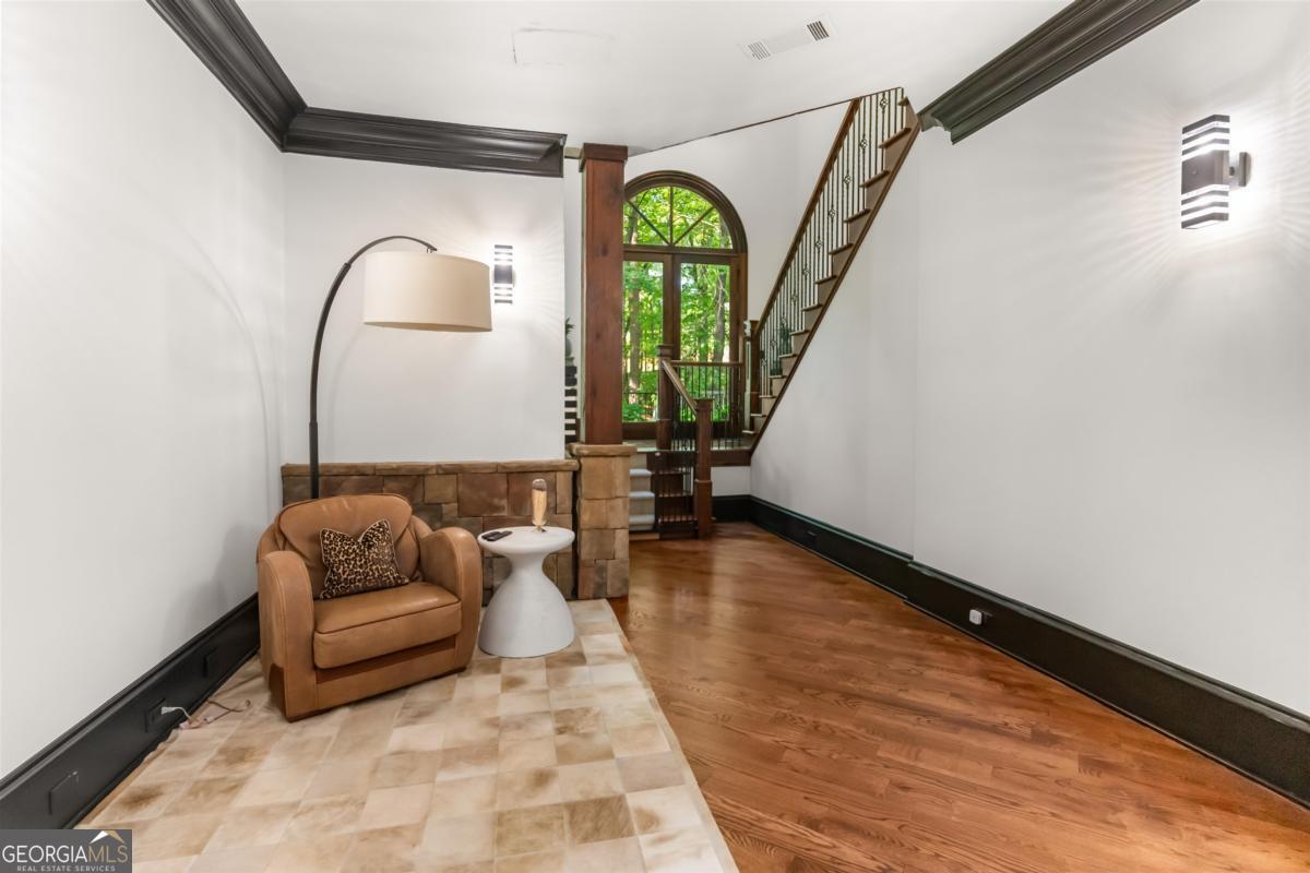 1090 Spring Creek Greensboro, GA 30642 - Photo 55 of 75 a living room with furniture and a wooden floor