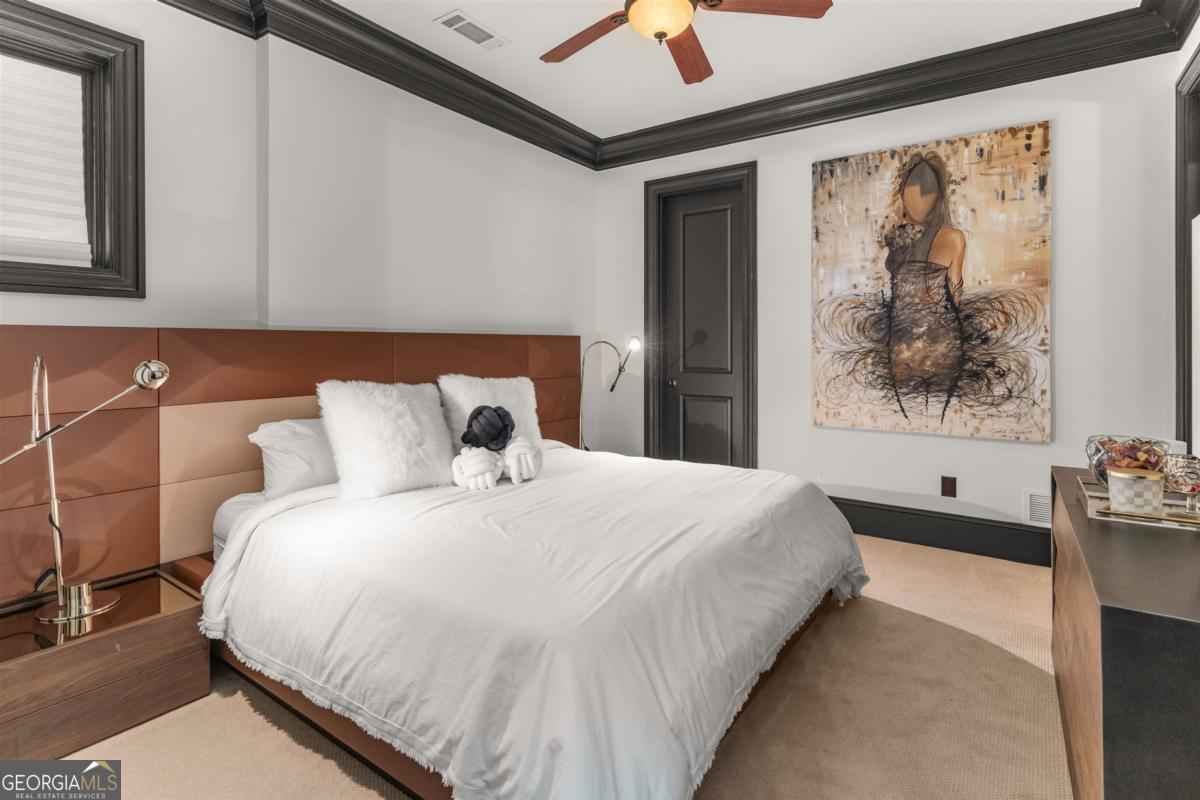 1090 Spring Creek Greensboro, GA 30642 - Photo 63 of 75 a bedroom with a bed and a painting on the wall