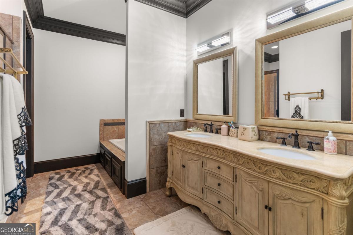 1090 Spring Creek Greensboro, GA 30642 - Photo 67 of 75 a bathroom with a sink a mirror and a toilet