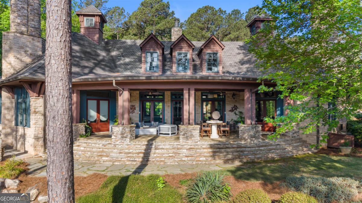 1090 Spring Creek Greensboro, GA 30642 - Photo 7 of 75 a view of a building with sitting area and garden