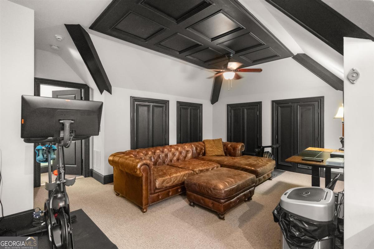 1090 Spring Creek Greensboro, GA 30642 - Photo 72 of 75 a living room with furniture and a chandelier