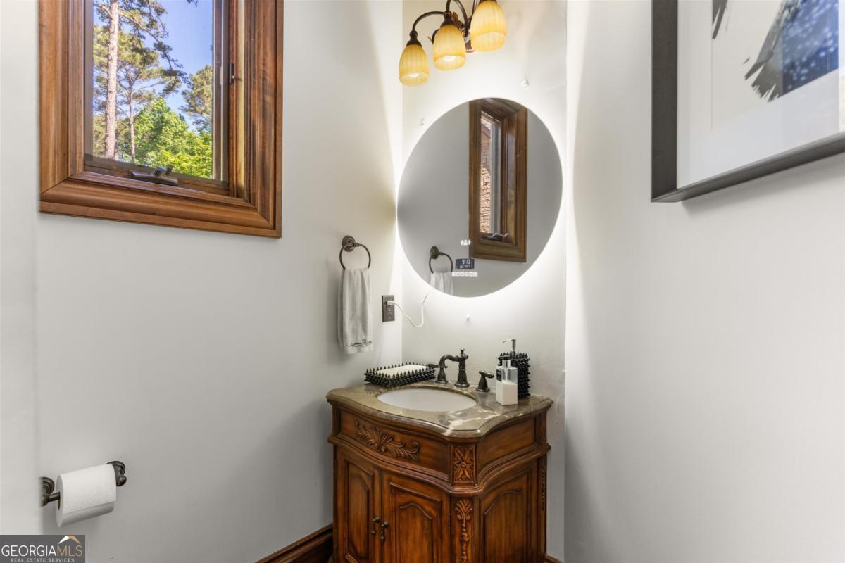 1090 Spring Creek Greensboro, GA 30642 - Photo 75 of 75 a bathroom with a sink and a mirror