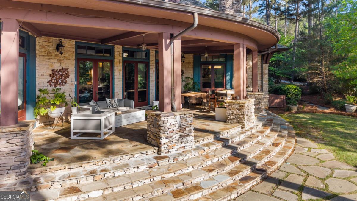 1090 Spring Creek Greensboro, GA 30642 - Photo 8 of 75 a view of a dinning table and chair in the patio