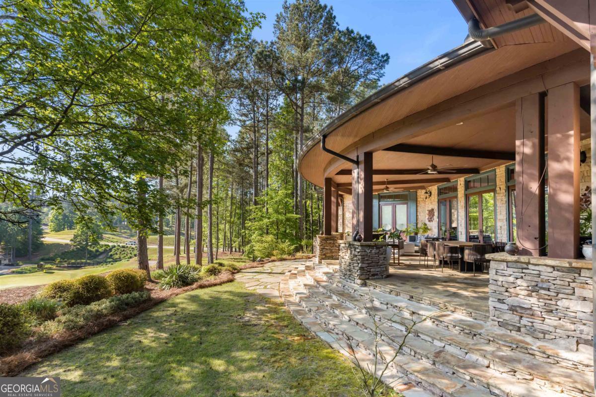 1090 Spring Creek Greensboro, GA 30642 - Photo 9 of 75 a view of the house with backyard and sitting area