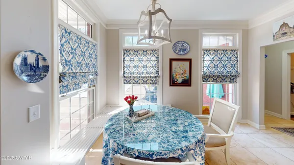 a view of a very nice looking dining room with a table and chair