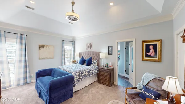 a bedroom with furniture and a window