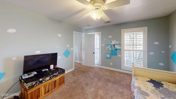 a room with furniture and a flat screen tv