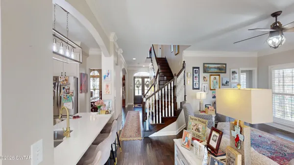 a livingroom with furniture wooden floor and windows