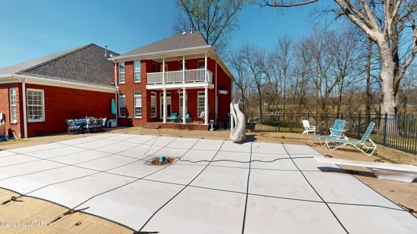 a view of roof deck with patio